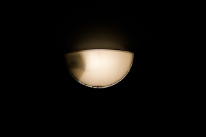 light fixture looks like moon against black background