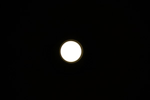 light fixture looks like moon against black background