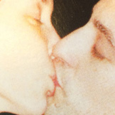 rephotographed found images of people kissing